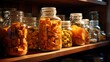 An evocative shot of dried fruit chunks, including mango, papaya, and coconut, stacked in transparent jars on a kitchen shelf.