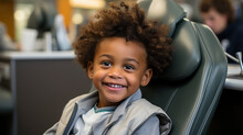
Little Boy In Dentist's Office Sitting In Chair And With Happy Smiling Face. Visit To The Dentist. Medical Exam. Concept Of Dental Health, Care And Prevention Of Cavities And Teeth. 