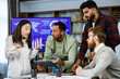 © YURII MASLAK - A team of young multinational business people are working on a startup. New generation of startups. communication network. Project discussion, quarrel, brainstorm, business idea generation