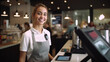 © tong2530 - A female cashier, Portrait of smiling merchant uses touchpad to accept customer payments, small business cafe cafeteria, Cashier working in store.