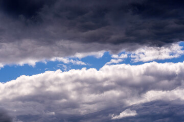 Wall Mural - Ornamental clouds. Dramatic sky. Epic storm cloudscape. Dark clouds, big storm and rain. Weather and nature concept