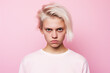 portrait of angry girl on pink background