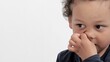 © herlanzer - boy picking his nose with white background with people stock image stock photo