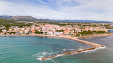 Fototapeta Desenie - Aerial drone photo of the coastal town and beach in L'Hospitalet de l'infant in Spain