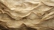 Close up of a piece of crinkled parchment, with sepia-toned streaks and creases. It looks like an old manuscript, with a story to tell.