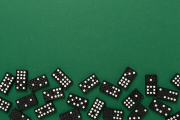 Wall Mural - Black domino tiles on color background, top view