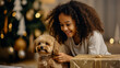 little African-American girl with a dog looks at Christmas gifts