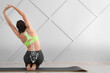 Sporty young woman training in gym. Concept of healthy spine