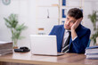 © Elnur - Young male employee and too much work in the office