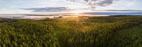 Fototapeta Natura - Scenic drone panorama photo of foggy sunrise over forest, landscape in North Sweden, golden sun light beams and shadows. Beautiful nature, Vasterbotten, northern Sweden, Umea, lens flare