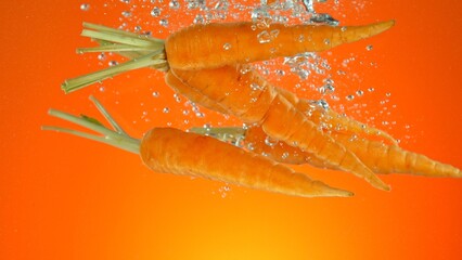 Aufkleber - Raw Baby Carrots Falling into Water.