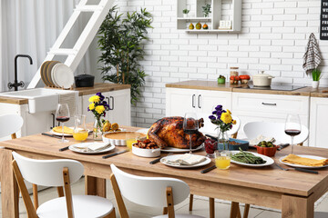 Poster - Festive dining table with tasty food for Thanksgiving Day in kitchen