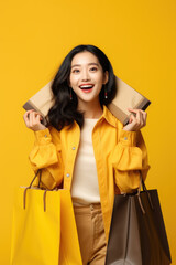 Poster - A woman is seen holding shopping bags in one hand and a credit card in the other. This image can be used to depict shopping, consumerism, retail therapy, or online shopping.