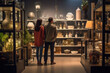 A man and a woman are seen examining vases in a store. This image can be used for interior design blogs or articles on home decor