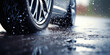 Car alloy wheels and tires, driving in wet conditions with water and puddle splashes