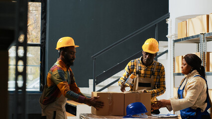 Wall Mural - African american people packing boxes with products, preparing stock for shipment order. Young storage room employees putting merchandise in cardboard packages, goods on racks.