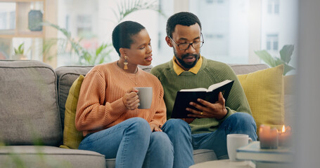 Canvas Print - Home, relax and black couple on a couch, bible and reading with religion, love and bonding together. Romance, apartment or man with woman, scripture and holy book with Christian, hope or conversation