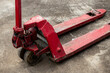 Old red forklift truck on the street. Close-up.