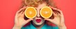 Beautiful healthy woman with slices of lemon citrus fruit isolated in orange background, food, cosmetics. Healthy eating, diet. Beauty young fashion woman plays with lemons, organic vegetables