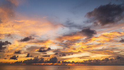 Wall Mural - abstract amazing scene of stuning colorful sunset or sunrise with clouds background in nature and tr