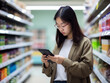 © kalafoto - Asian-american women check their shopping list on their smartphones at a supermarket