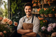 © NE97 - A male florist gardener, a small business owner in a flower shop, poses beautifully in a greenhouse,