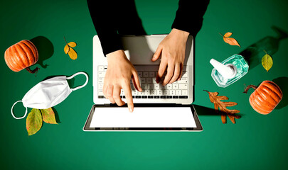 Poster - Person using a laptop computer with a mask and a sanitizer bottle in Autumn