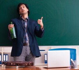 Poster - Male teacher drinking in the classroom