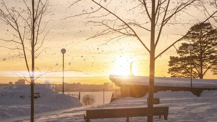 Wall Mural - 4K Beautiful snowy white city park on a frosty winter day. There is snow in the winter. Winter park, hyperlapse camera movement, time lapse. Snowy weather. Sunset Sunrise Sun in sunny winter in snowy