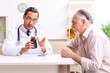 © Elnur - Young male doctor visiting old patient at home