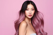 © ribalka yuli - Beautiful, young Asian girl with fresh clean skin, long, dyed pink hair posing on a pink background