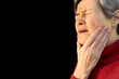 Asian elder woman suffering from toothache