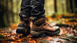 Close-up of feet in hiking boots on a hiking trail in the mountains. Lifestyle concept, walking outdoors.