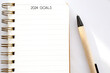 2024 goals on blank notebook paper on white background, 2024 new year mock up, template, flat lay
