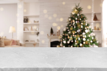 Canvas Print - Light grey marble table in room with Christmas tree. Space for design