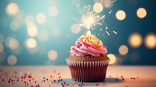 Indulge In The Delight Of A Scrumptious Birthday Cupcake Elegantly Displayed On A Table Against A Soft, Light Background.