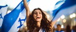 © Mickael - Portrait of pretty and happy Israeli woman standing with smile, in front of Israel flags, shouting, celebrating victory or success. Generative ai