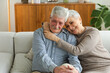 © Юлия Завалишина - Senior adult mature couple hugging at home. Mid age old husband and wife embracing with tenderness love enjoying sweet bonding wellbeing. Grandmother grandfather together. Family moment love and care