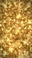 Wall Mural - abstract christmas background in vertical composition format of a blurred bokeh of animated golden l