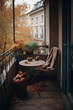 Small cozy city balcony with table in autumn