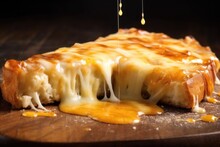 Melted Smoked Cheese On A Slice Of Pizza