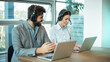 © Bojan - Two call center agent smiling happy working at the office.