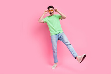 Poster - Full body view photo of attractive funky guy dancing have fun touch specs sunglasses discotheque party isolated on pink color background