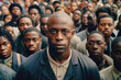 Emotionless serious black man with sad gaze looking in a camera and standing in group of people