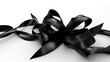 © Nadia - a black ribbon is laying on a white surface with a white background.  generative ai