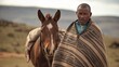 Unidentified basotho man with his horse wearing traditional blanket - Lesotho 