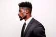 © Uliana - Successful young man in classic suit with African appearance on white isolated background