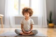child sitting quiet in meditation stance