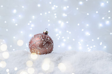 Canvas Print - White christmas with snow - pink ball in snow close up