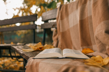 Wall Mural - Open Bible on a blanket, autumn